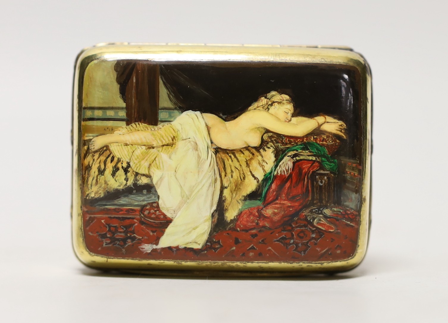 A George V silver gilt box and cover, by Albert Barker, London, 1913, the cover later? enamelled with a reclining nude, 90mm, gross weight 4.9 oz.
